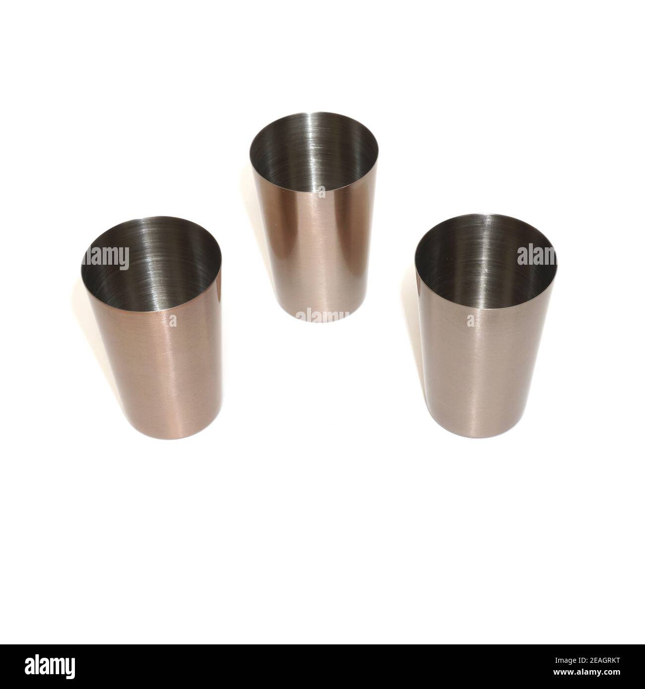 Stainless steel metal shot glasses for liqueur isolated on white background Stock Photo