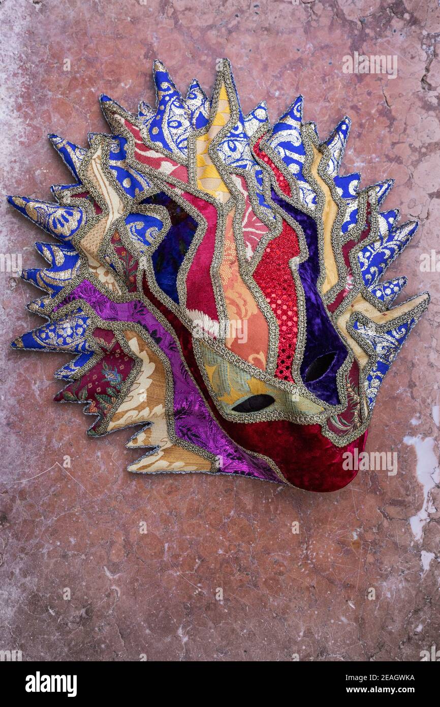 Textile embellished paper mâché mask by artist Carlo Setti from Venice. Stock Photo