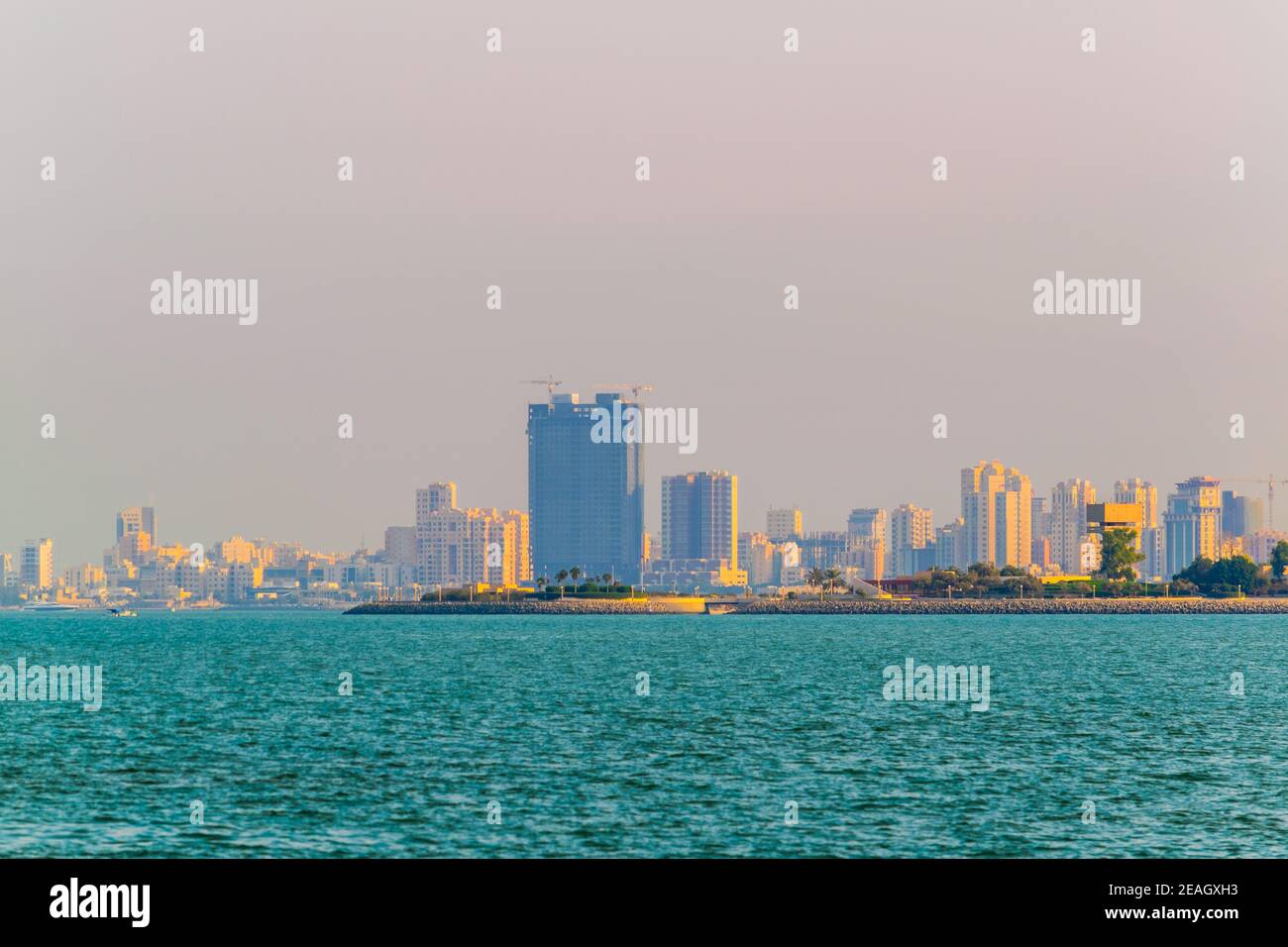 Skyline of Kuwait during sunset Stock Photo - Alamy