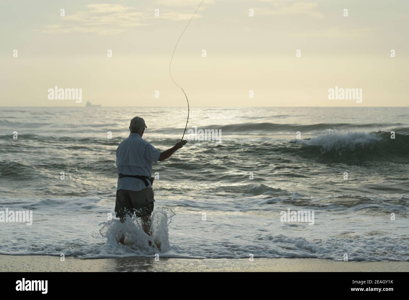 Fly fishing, people, sport, single adult man casting lure into sea,  fisherman, Durban, South Africa, beautiful landscape, saltwater, beach  activity Stock Photo - Alamy