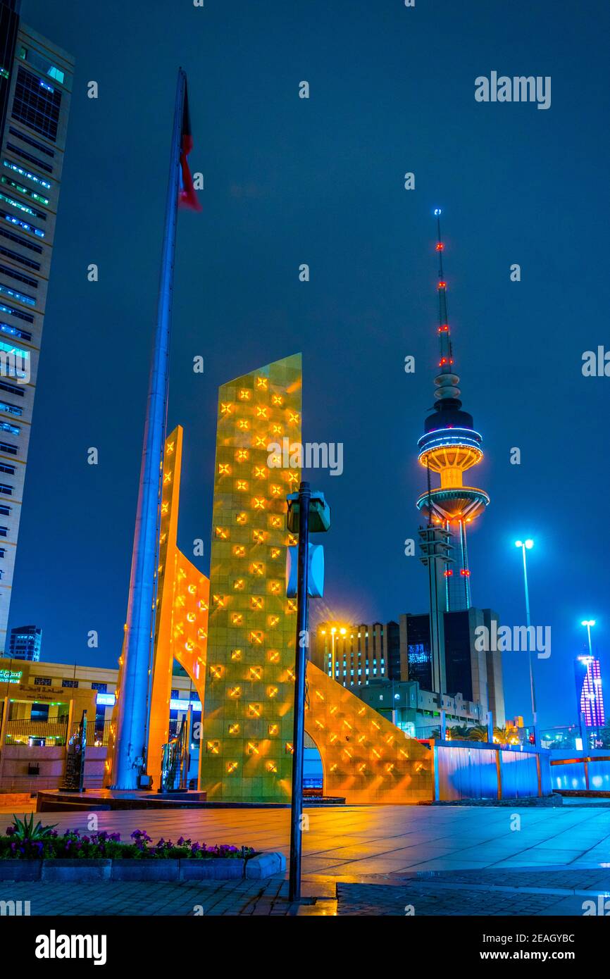 View of a a golden monument with a small park in the central Kuwait during night. Stock Photo