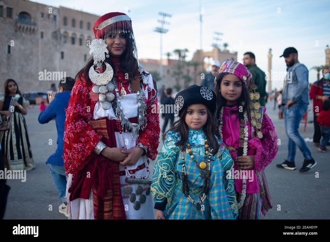 Tripoli. 4th Feb, 2021. Libyan girls in traditional dresses pose for a photo at the Martyr's Square in Tripoli, Libya on Feb. 4, 2021. As the 10th anniversary of the Libyan uprising that toppled late leader Muammar Gaddafi's regime approaches, Libyan analysts believe the war-torn country is facing a real chance for restoring political stability, especially with the recent creation of a new executive authority. Credit: Nada Harib/Xinhua/Alamy Live News Stock Photo