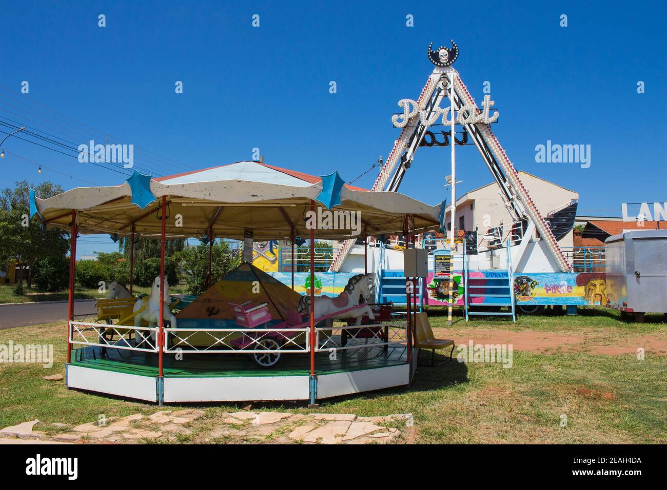Ibitinga, SP, Brazil - 02 07 2021: Pirate ship and carousel at a amusement park Stock Photo