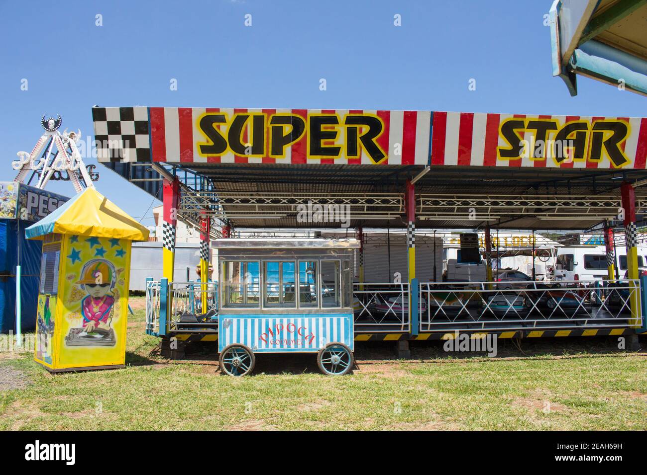 Ibitinga, SP, Brazil - 02 07 2021: A vintage popcorn cart in front of a Bumper Cars Ride at an Amusement Park Stock Photo