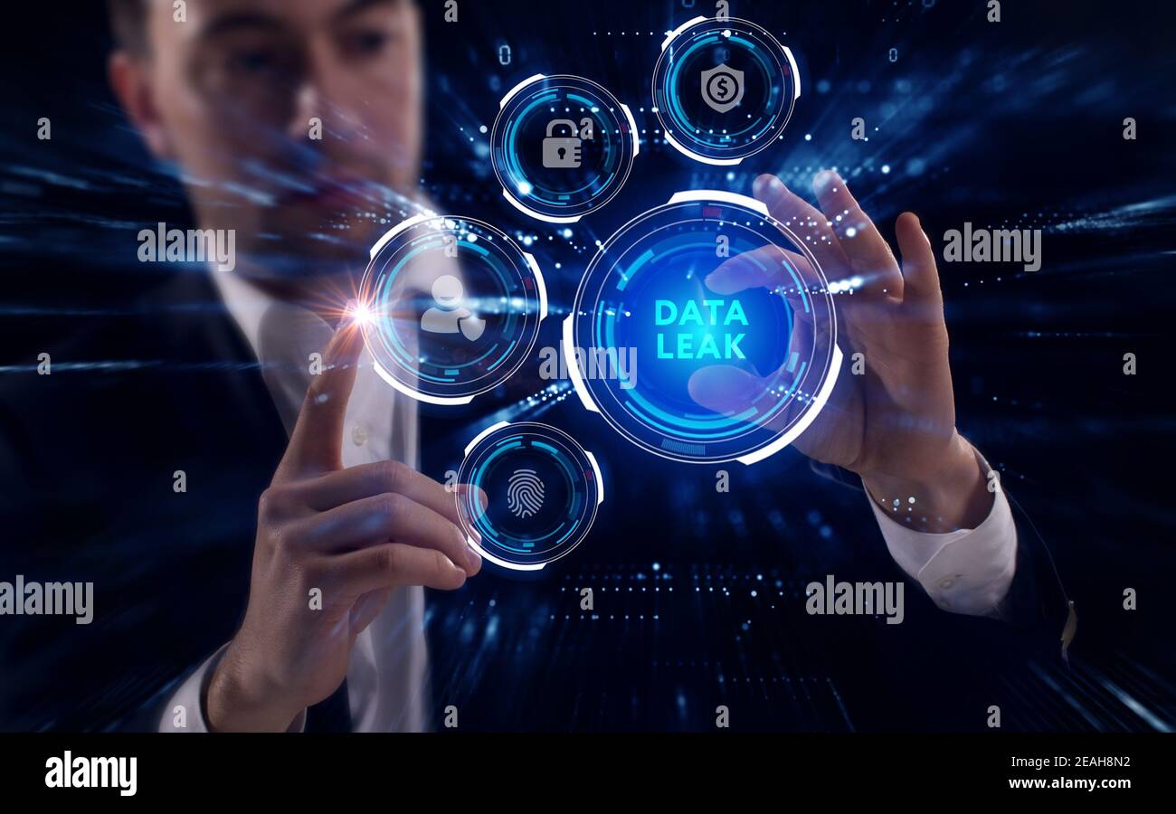Business, Technology, Internet and network concept. Young businessman working on a virtual screen of the future and sees the inscription: Data leak Stock Photo