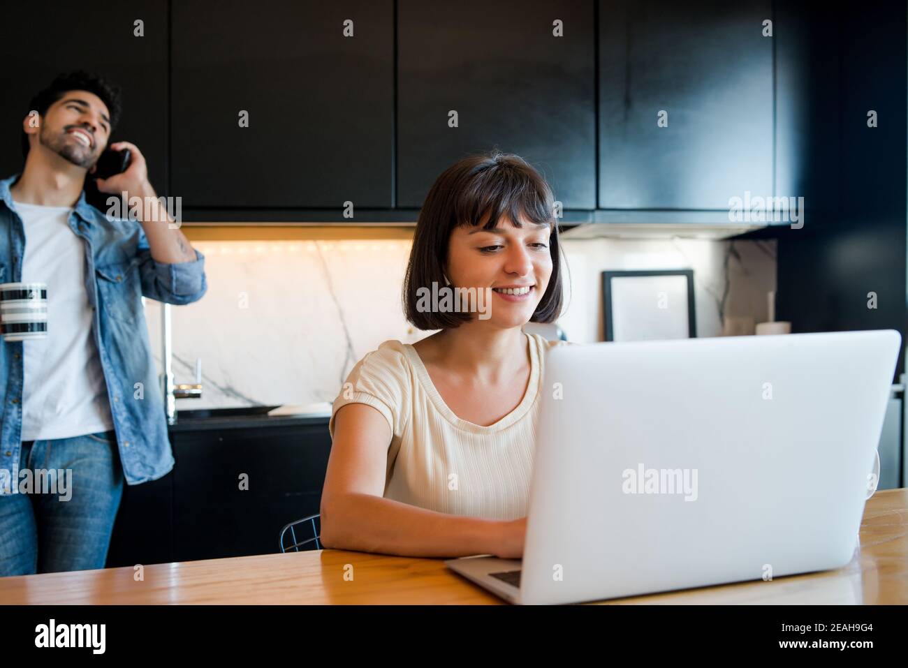 Young woman working from home Stock Photo - Alamy