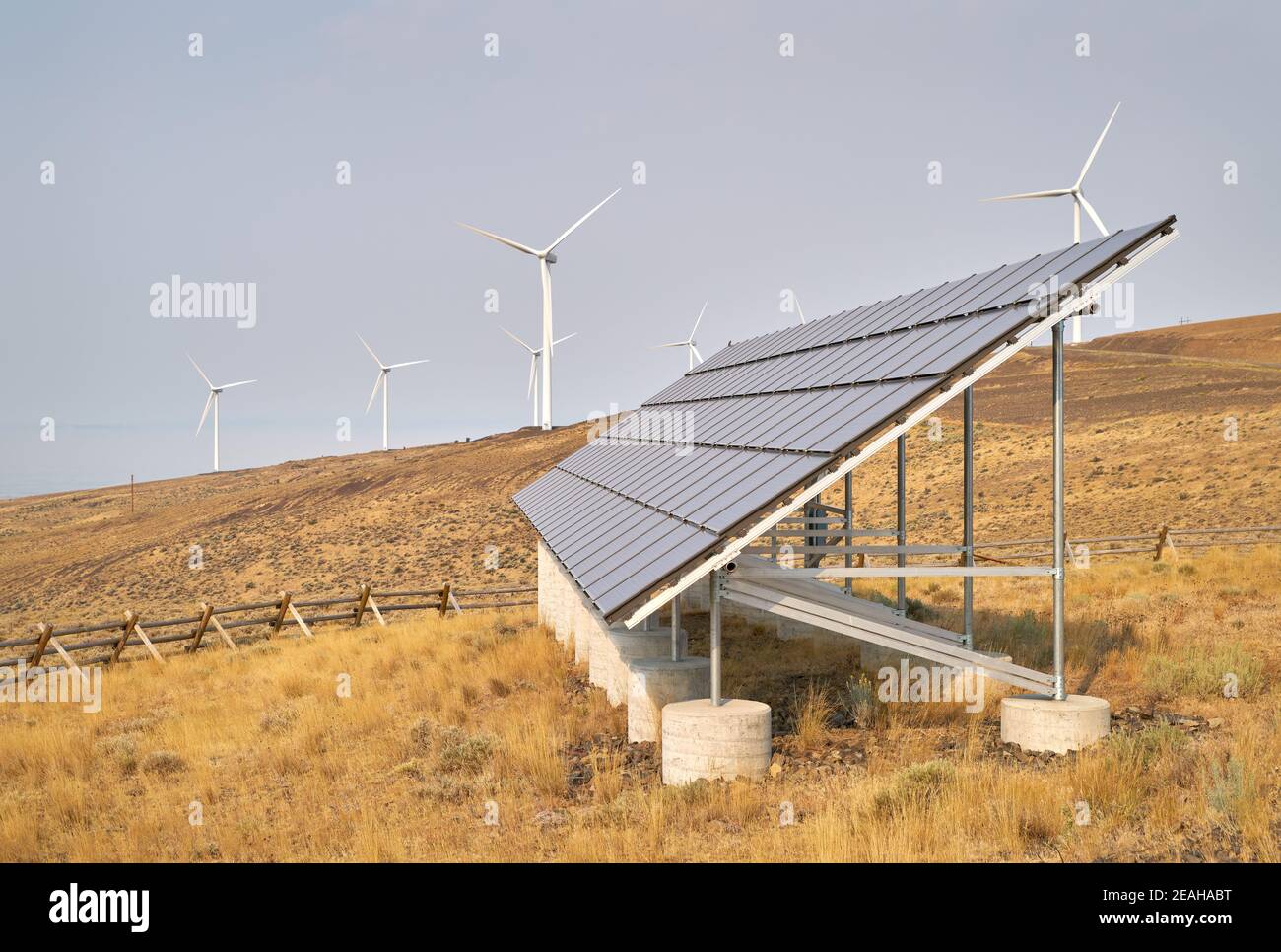 Wind Turbines and Solar Panel. Wind turbines and solar panels on an arrid field of grass in Washington State. Stock Photo