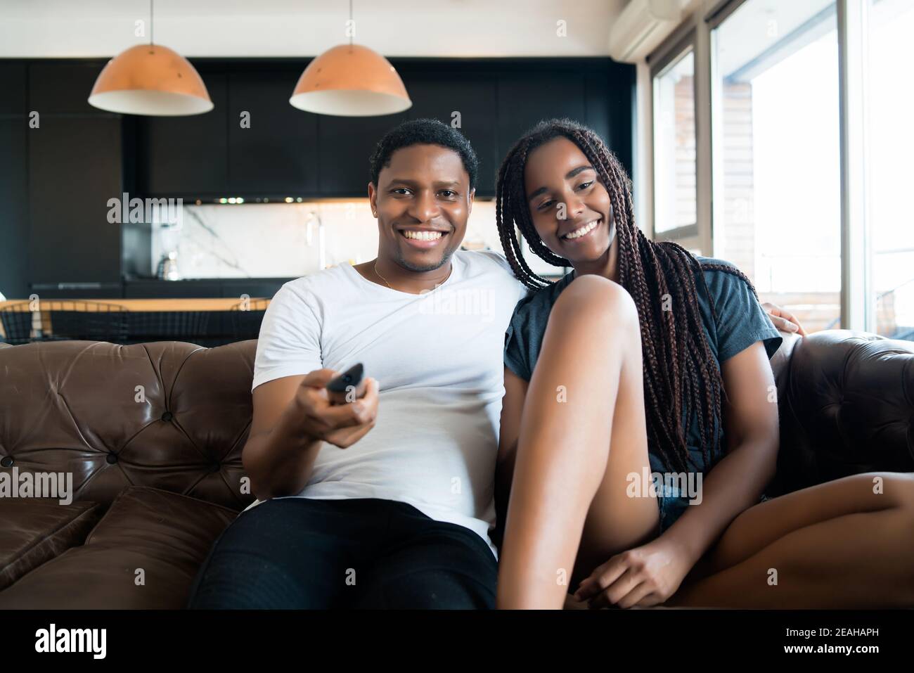 Couple spending time together while staying at home. Stock Photo