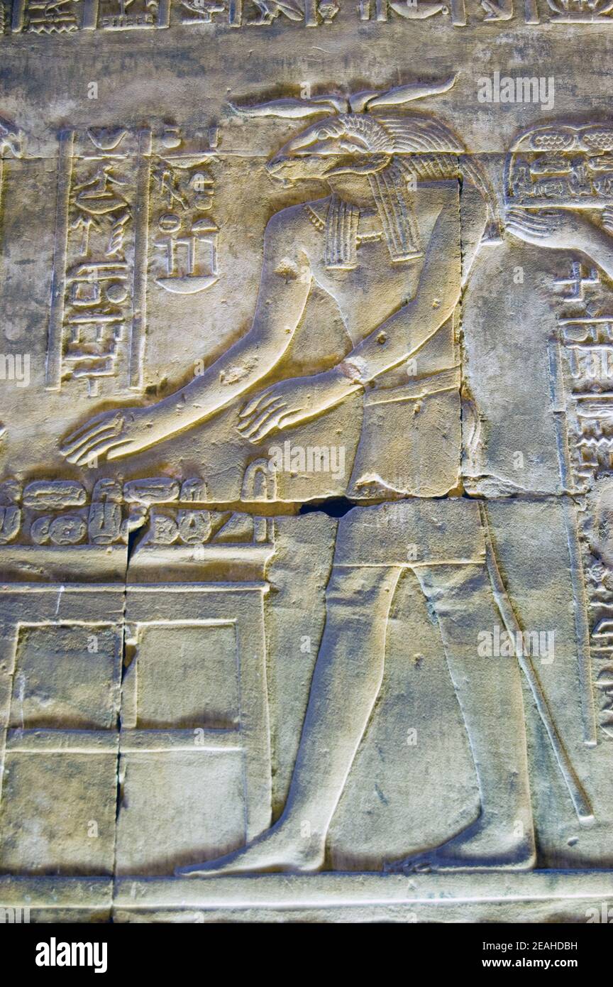 Ancient egyptian stone carving of the ram headed god Khnum. Interior of the Temple of Horus, Edfu, Egypt. Stock Photo