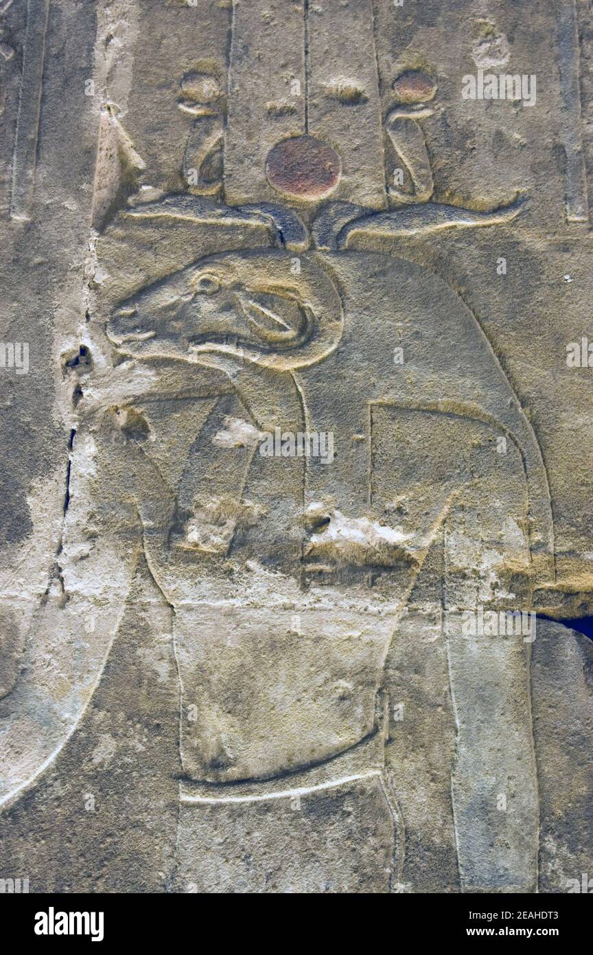 Ancient Egyptian decorated carving of the ram headed god Khnum. Interior chapel of the Temple of Horus, Edfu, Egypt. Stock Photo