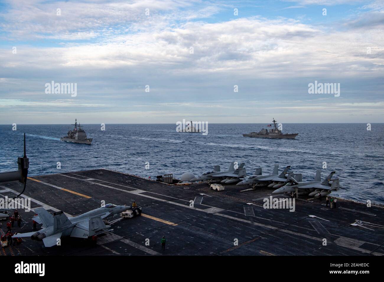 Handout photo of – The Theodore Roosevelt Carrier Strike Group transits in formation with the Nimitz Carrier Strike Group in the South China Sea February 9, 2021. Two US Navy aircraft carrier strike groups began operations in the disputed waters of the South China Sea on Tuesday, the latest show of naval capabilities by the Biden administration as it pledges to stand firm against Chinese territorial claims.The carriers USS Theodore Roosevelt and USS Nimitz and their accompanying guided-missile cruisers and destroyers are showing the US Navy's ability to operate in highly trafficked, challengin Stock Photo