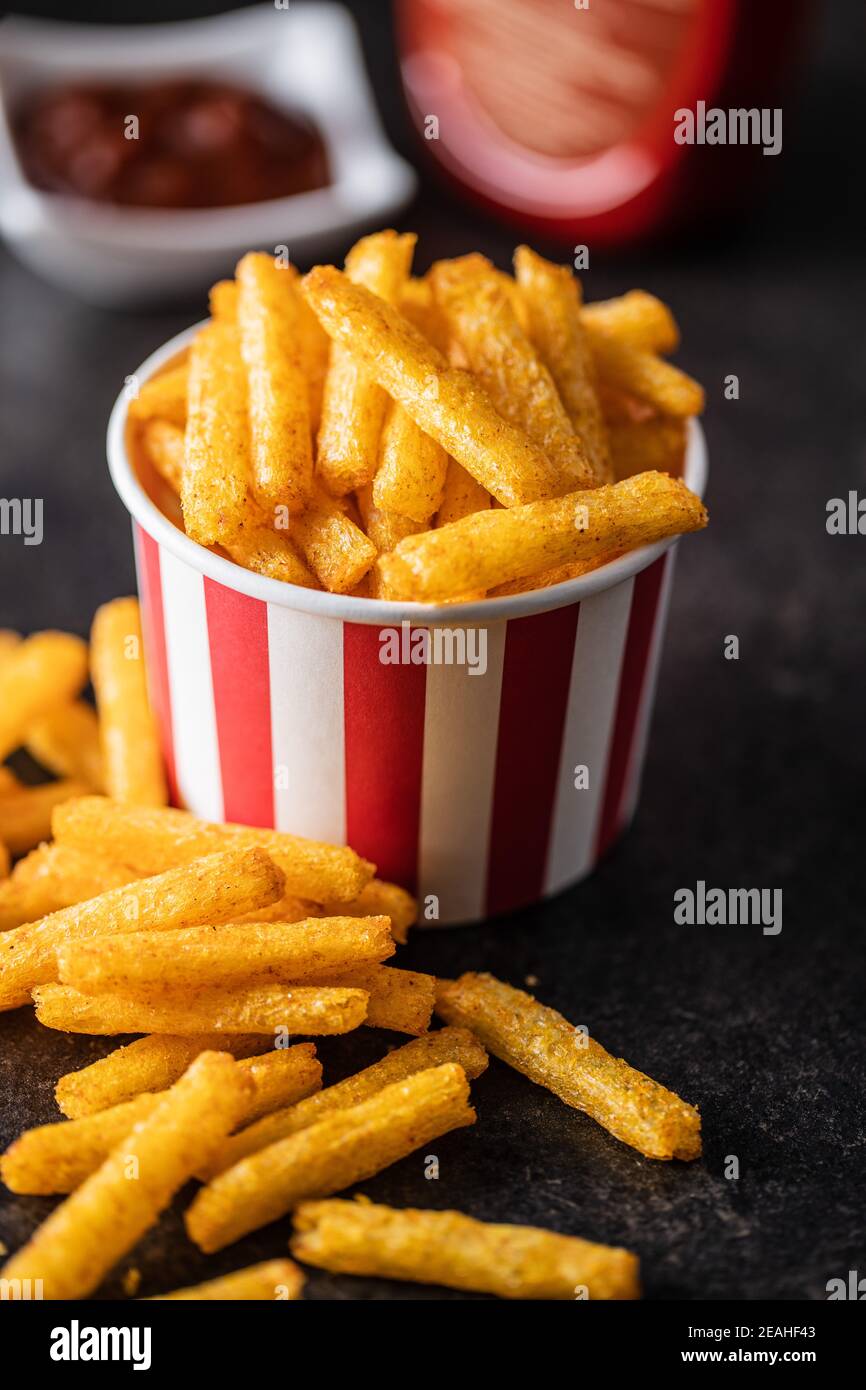 French fries. Salted snack. Potato chips in paper cup Stock Photo Alamy