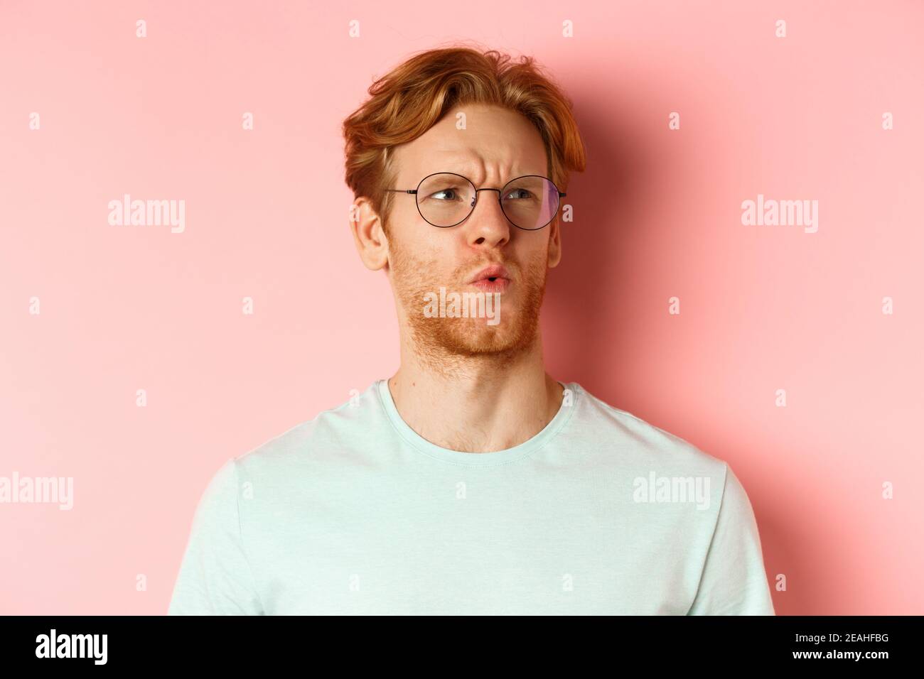 Ouch Thats Bad Face Of Redhead Man Showing Pity And Feeling Sorry For Someone Frowning And Looking With Compassion Standing Over Pink Background Stock Photo Alamy