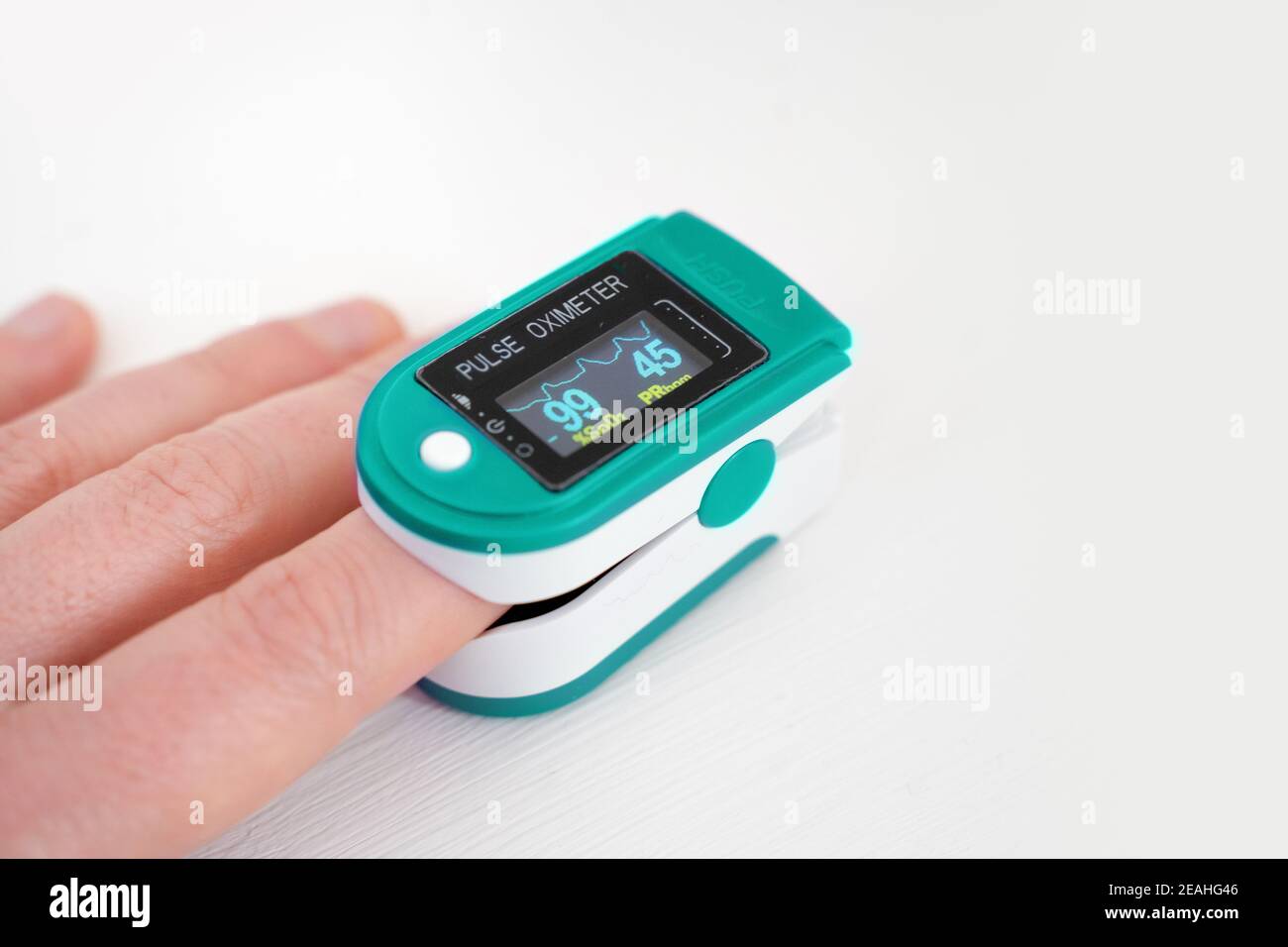 Pulse oximeter, finger digital device to measure oxygen saturation in blood on white Stock Photo