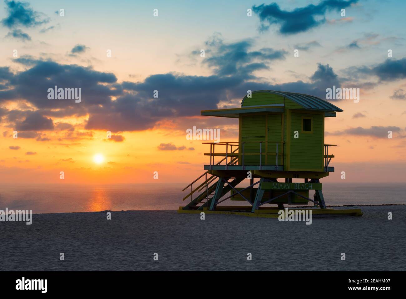 Beautiful sunrise at tropical Miami beach and life guard tower, South Miami Beach, Florida. Stock Photo
