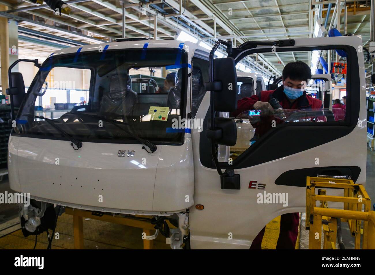 QINGZHOU, CHINA - FEBRUARY 8, 2021 - A worker works on a production ...