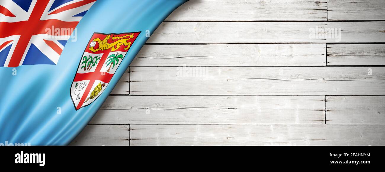 Fiji flag on old white wall. Horizontal panoramic banner Stock Photo