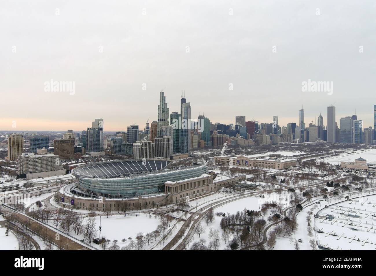 An aerial view of a snow-covered Soldier Field and the downtown skyline, Sunday, Feb. 7, 2021, in Chicago. Stock Photo