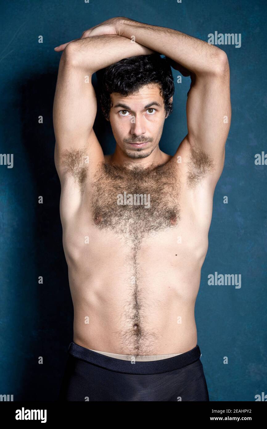 Male dancer in dynamic, modern dance poses and body movement in the