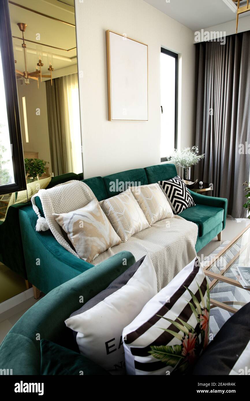 Modern scandinavian living room interior with dark green sofa, design