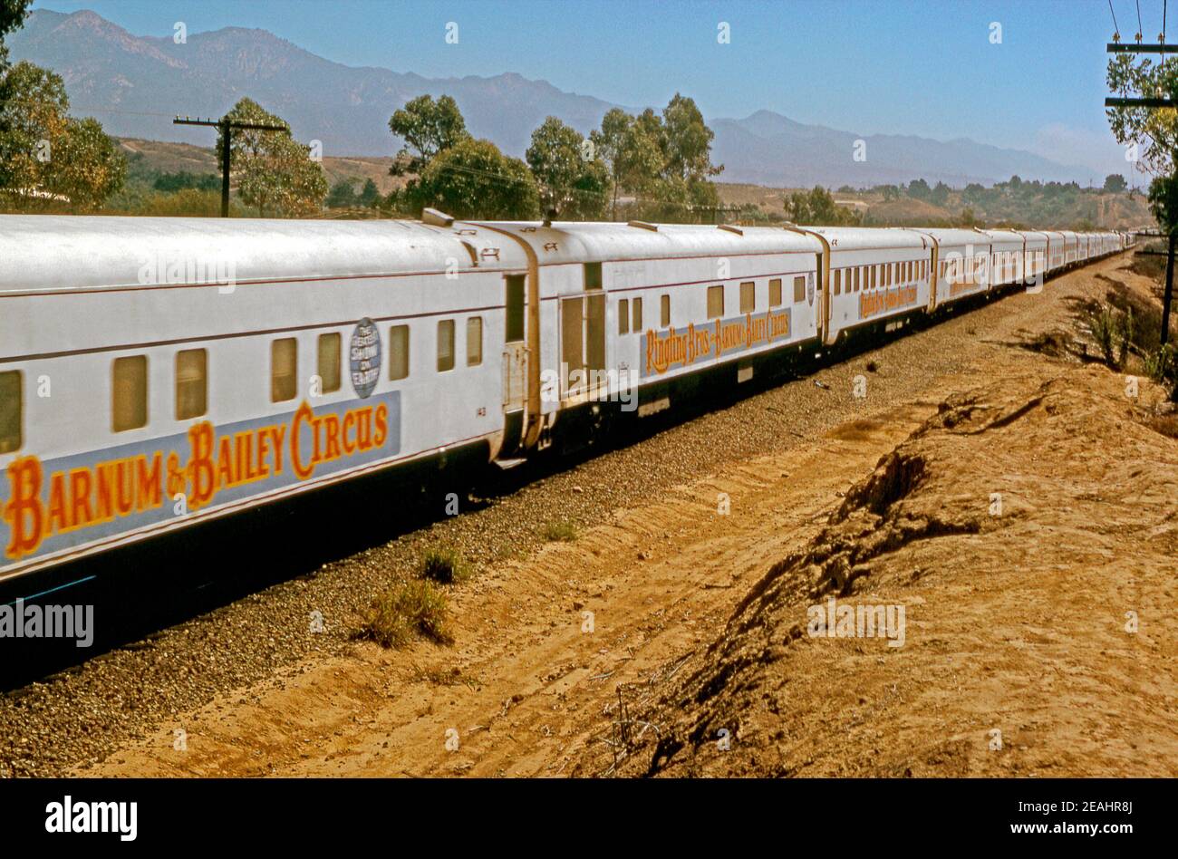 The Ringling Bros and Barnum and Bailey Circus Train in rural USA in 1972. It was called ‘The Greatest Show on Earth’. Trains were first used in 1872 and this train is pulled by two Southern Pacific GP35 diesel locomotives. The trains stretched to over a mile long. This image is from an old American amateur Kodak 35mm colour transparency. Stock Photo