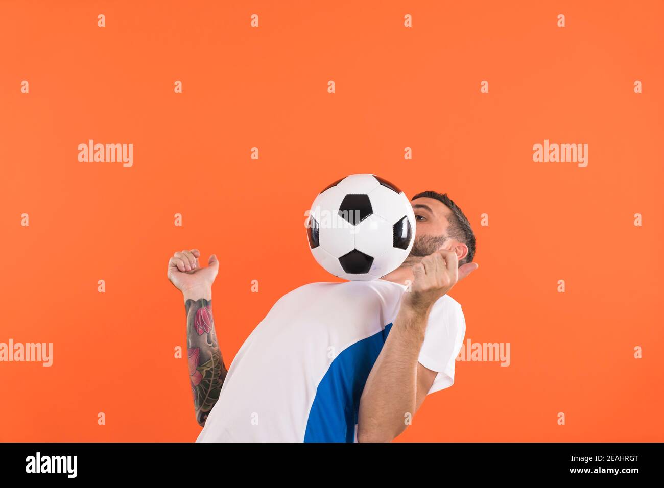 Football player balance the ball at chest Stock Photo