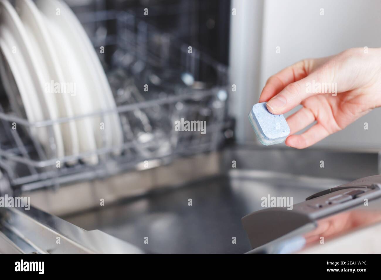 Fairy Platinum All in One dishwasher tablet in soap compartment of  dishwasher Stock Photo - Alamy