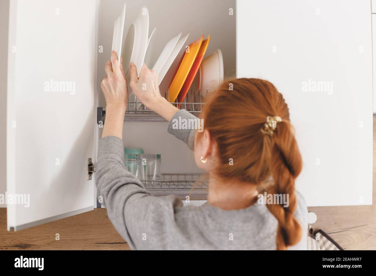 Hand opening kitchen cupboard hires stock photography and images Alamy
