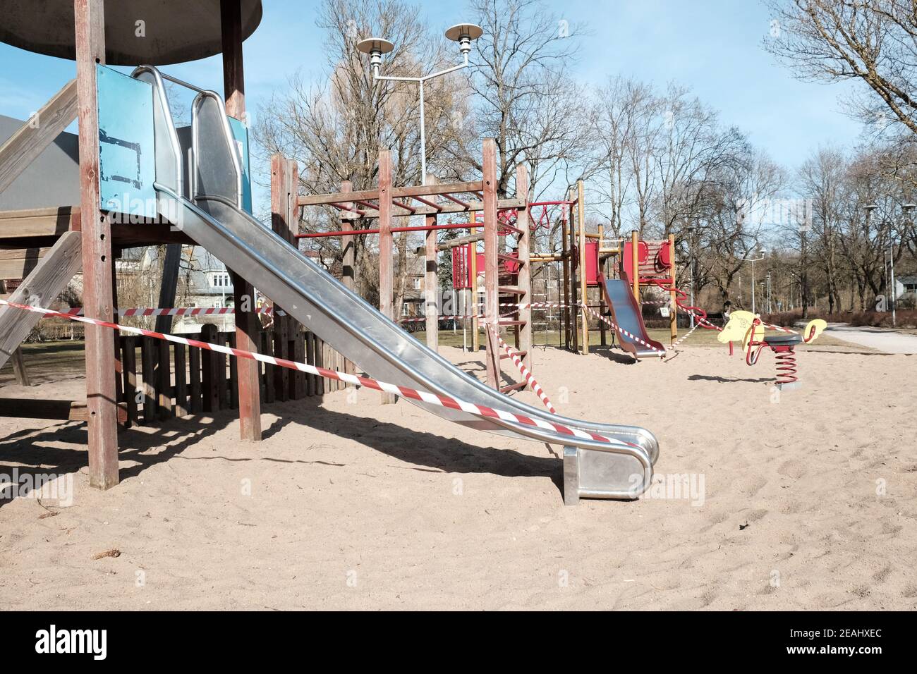 Restricted playground in a city park during COVID-19 lockdown. Stock Photo