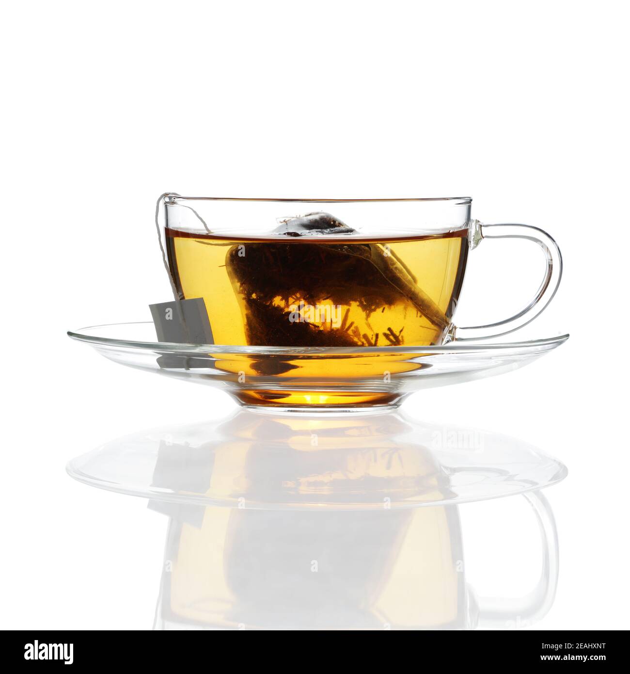 Tea in glass cup with saucer on white with reflection Stock Photo Alamy