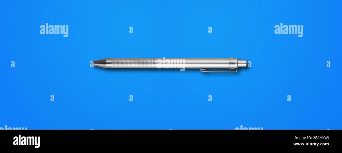 Metal pen isolated on blue background Stock Photo