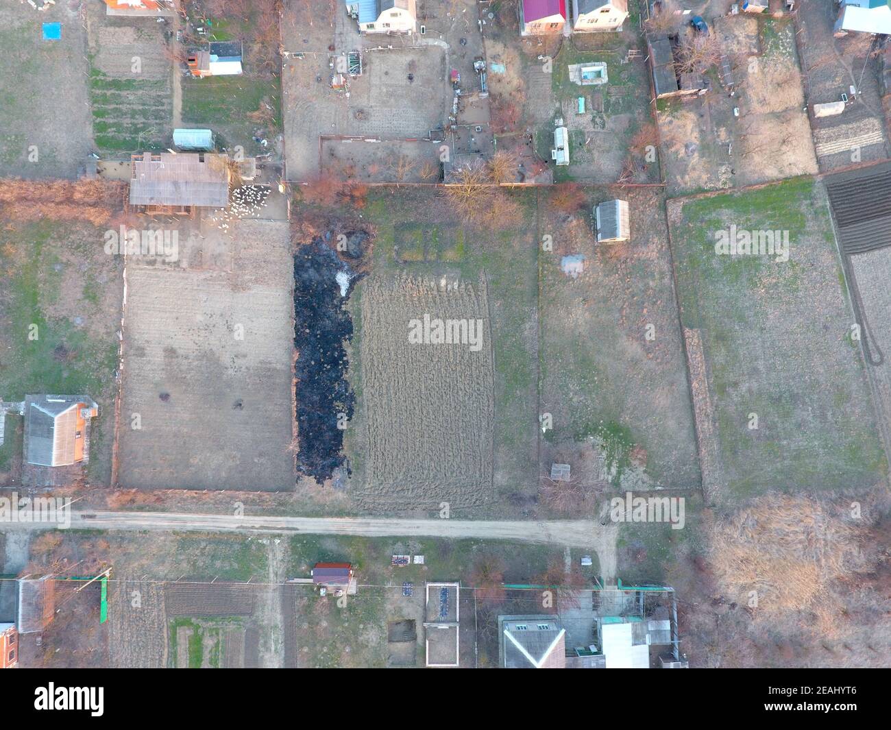 Plots of land for building. Compound and vegetable gardens. View from above. Stock Photo