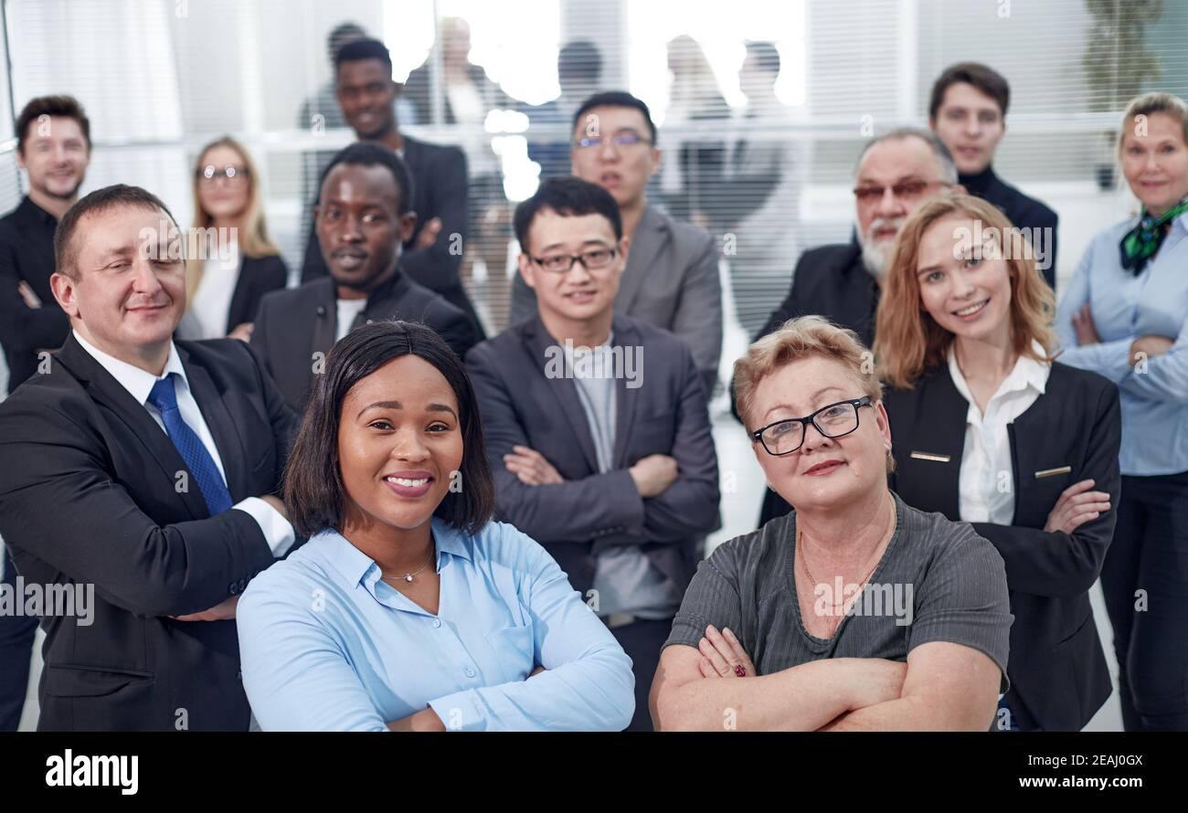 Happy business wonmen with arms crossed at the office Stock Photo - Alamy