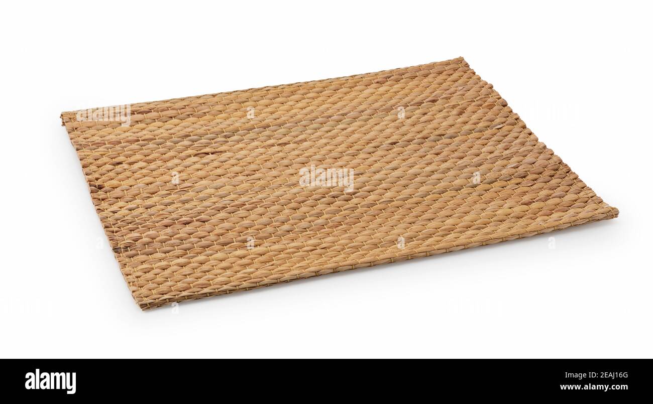 A woven luncheon mat on a white background Stock Photo - Alamy