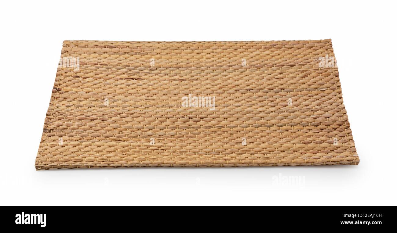 A woven luncheon mat on a white background Stock Photo - Alamy