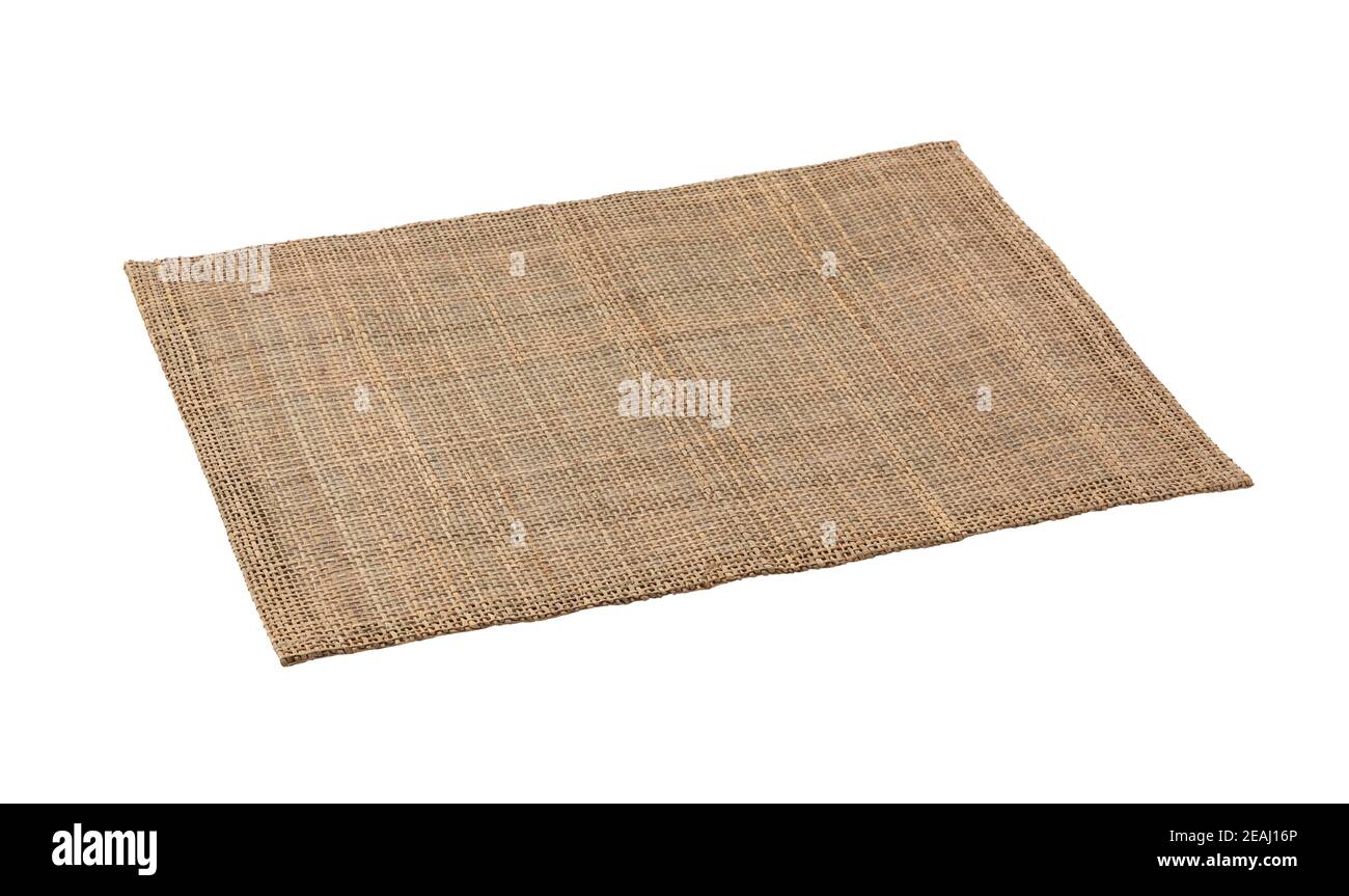 A woven luncheon mat on a white background Stock Photo - Alamy