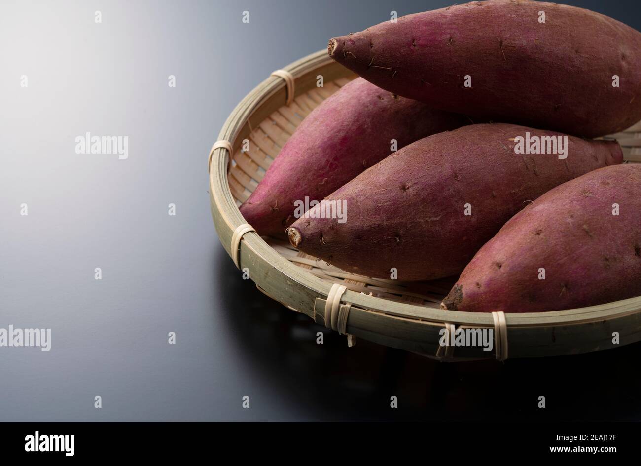 Sweet potatoes on a black background Stock Photo