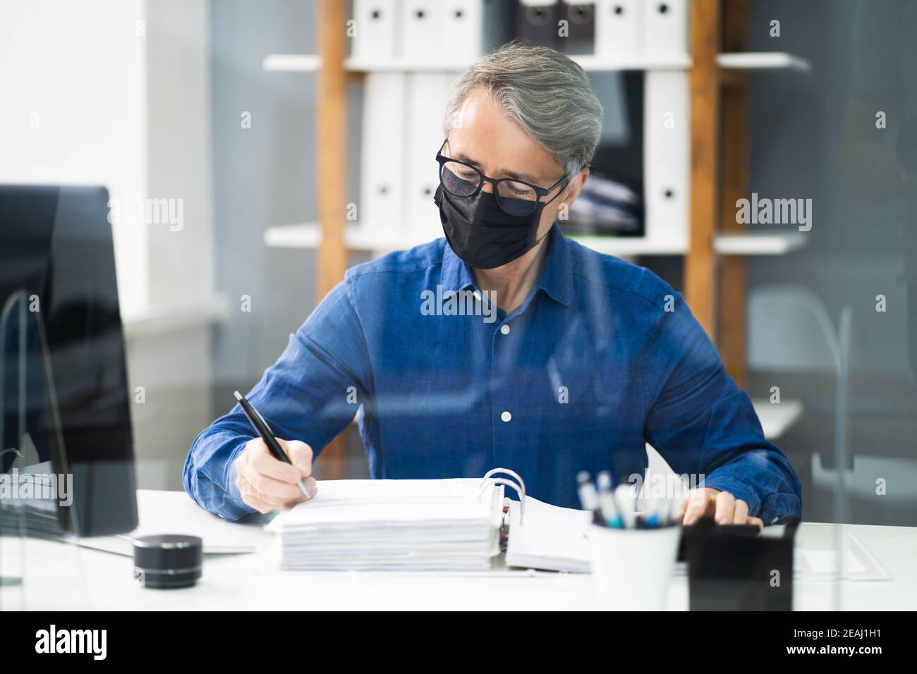 Senior Accountant Man Working With Invoice Stock Photo - Alamy