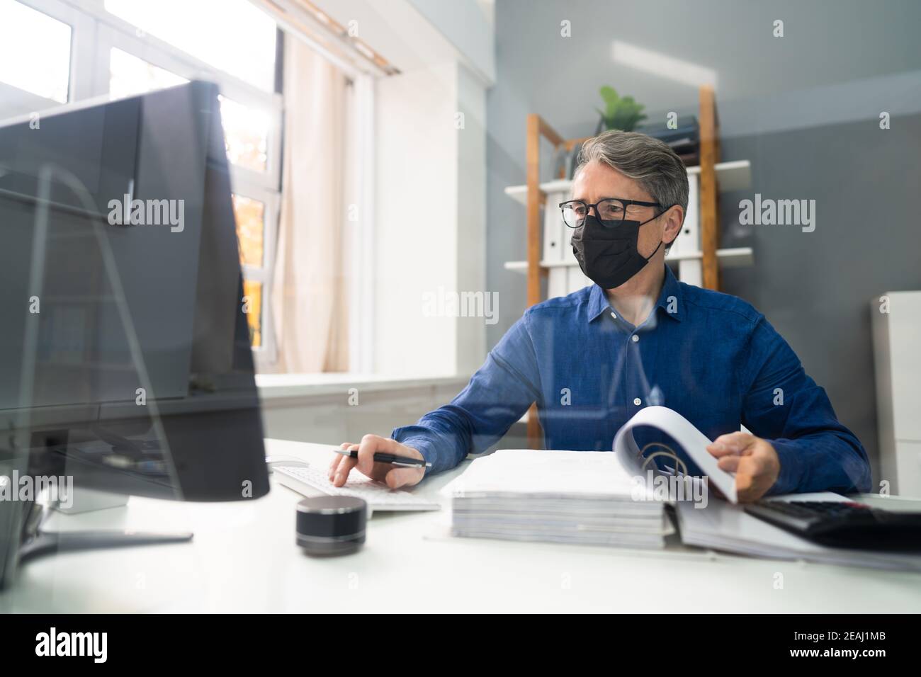 Senior Accountant Man Working With Invoice Stock Photo