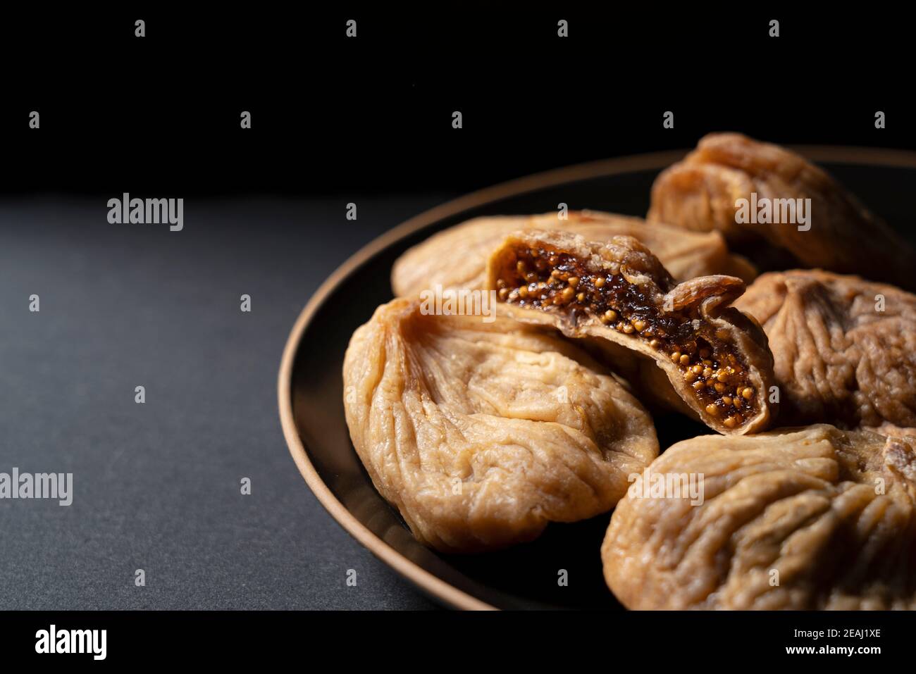 Dried figs on a black background Stock Photo