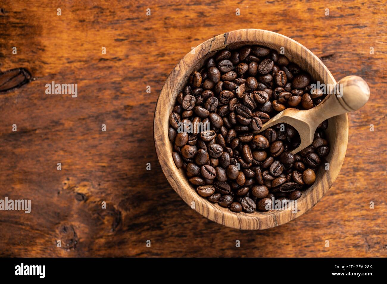 Roasted coffee beans in wooden bowl Stock Photo - Alamy