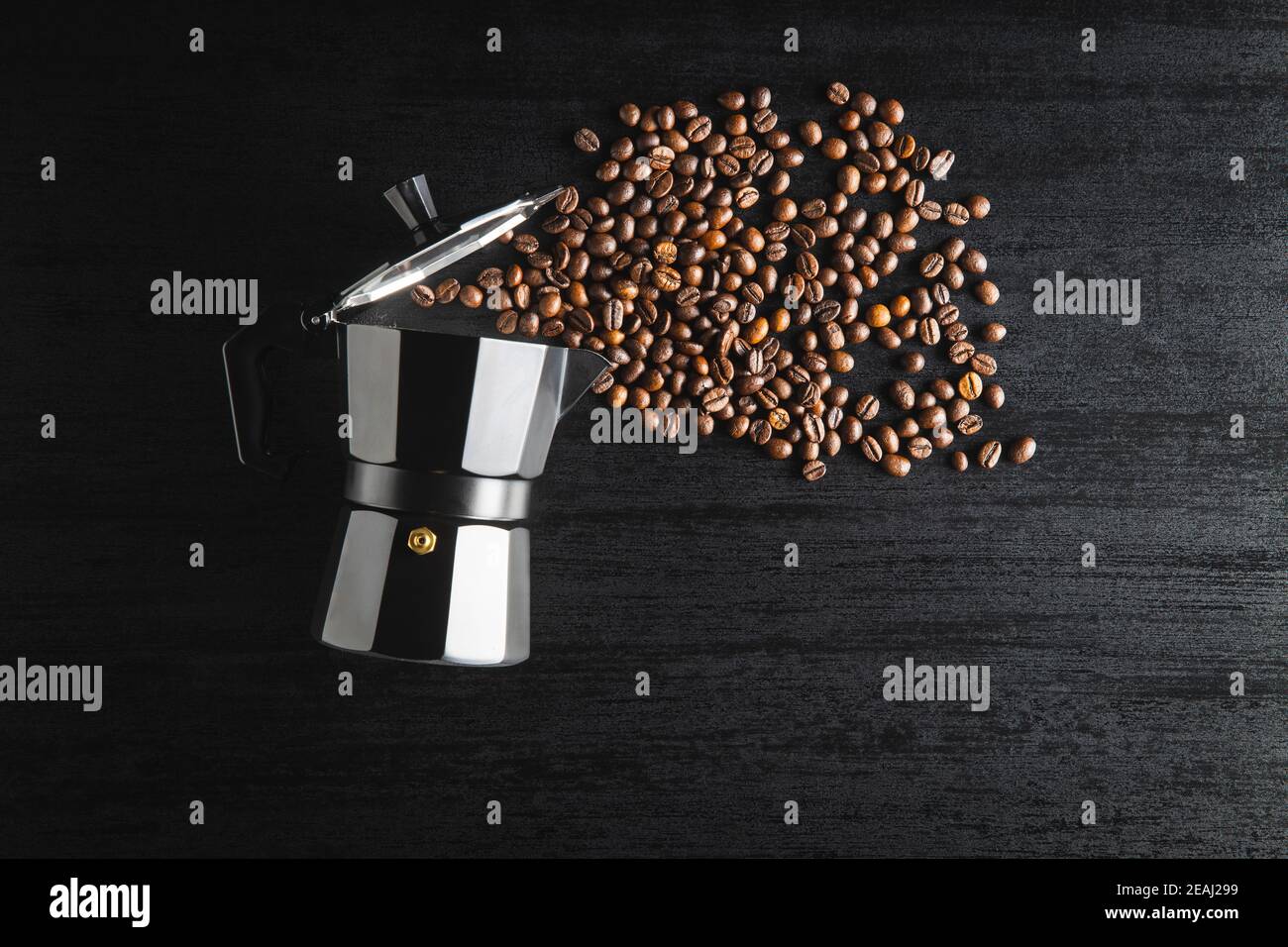 Coffee beans and bialetti coffee maker. Moka pot Stock Photo Alamy