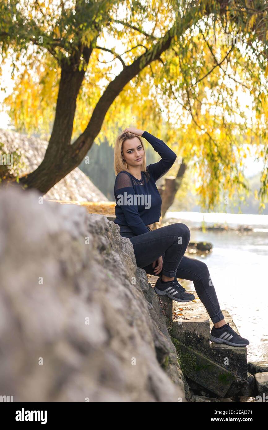 BANJA LUKA, BOSNIA AND HERZEGOVINA - Oct 18, 2017: Portrait of blond girl  in park wearing Adidas sneakers Stock Photo - Alamy