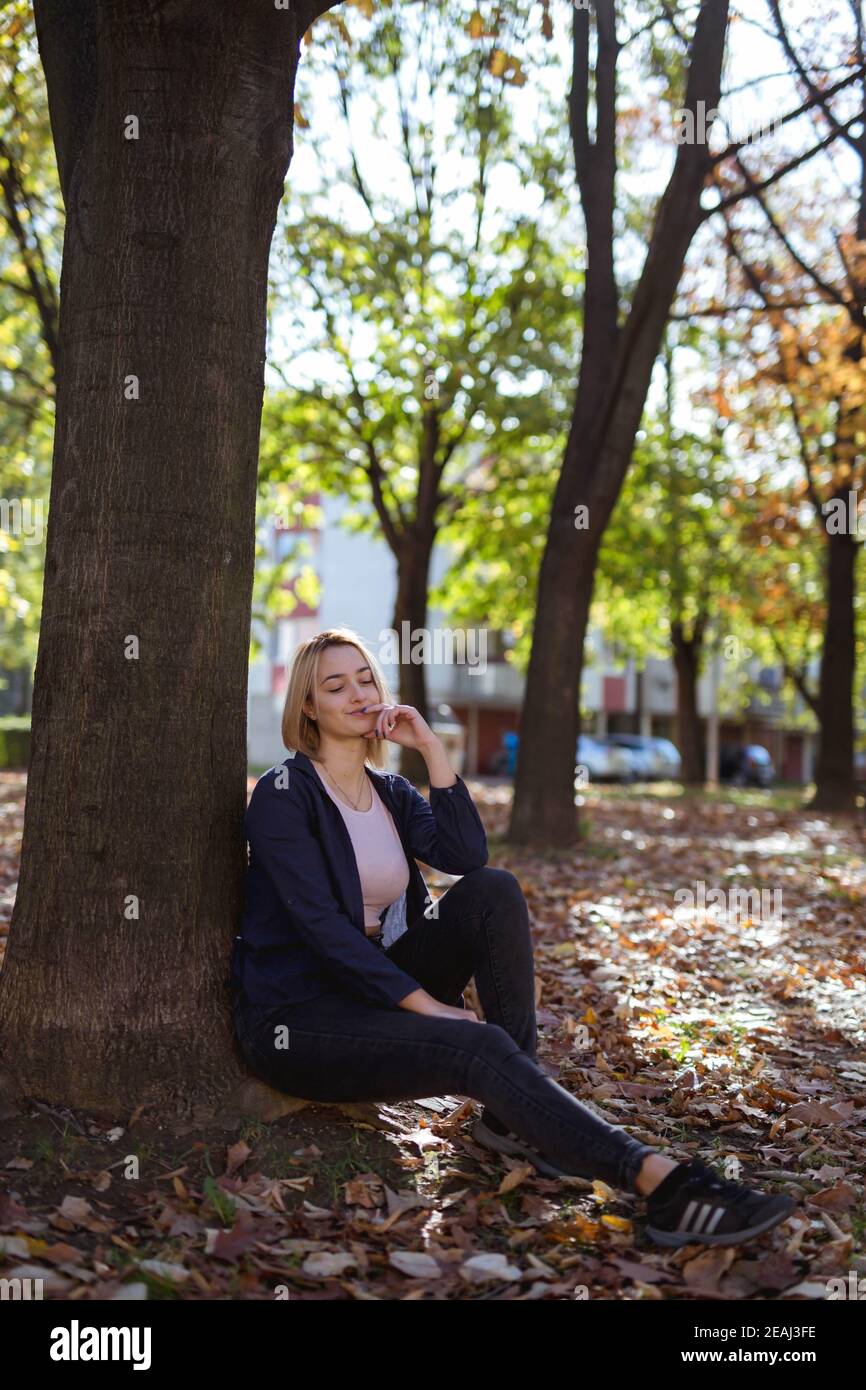 BANJA LUKA, BOSNIA AND HERZEGOVINA - Oct 18, 2017: Portrait of blond girl  in park wearing Adidas sneakers Stock Photo - Alamy