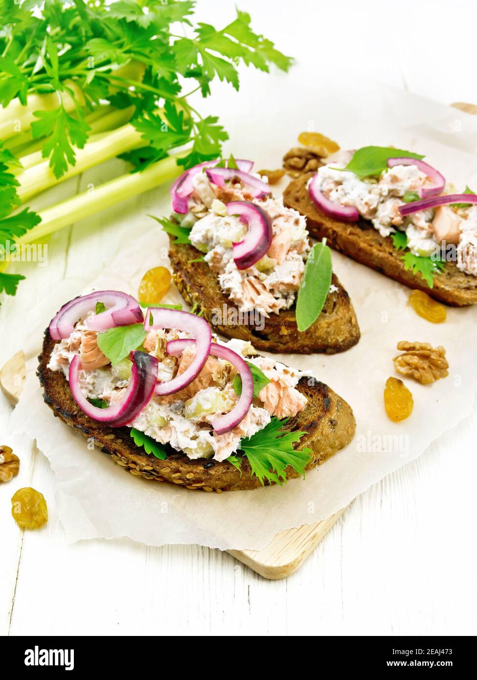 Bruschetta with fish and curd on white board Stock Photo