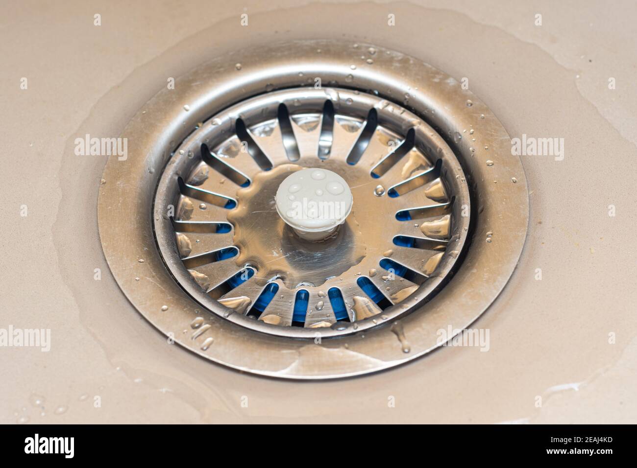Drain in the sink with a mesh lid close-up Stock Photo
