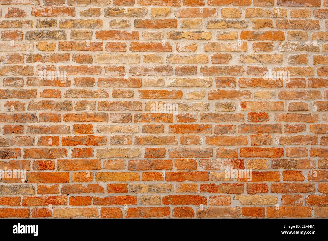 Background from an old and worn orange brick wall Stock Photo