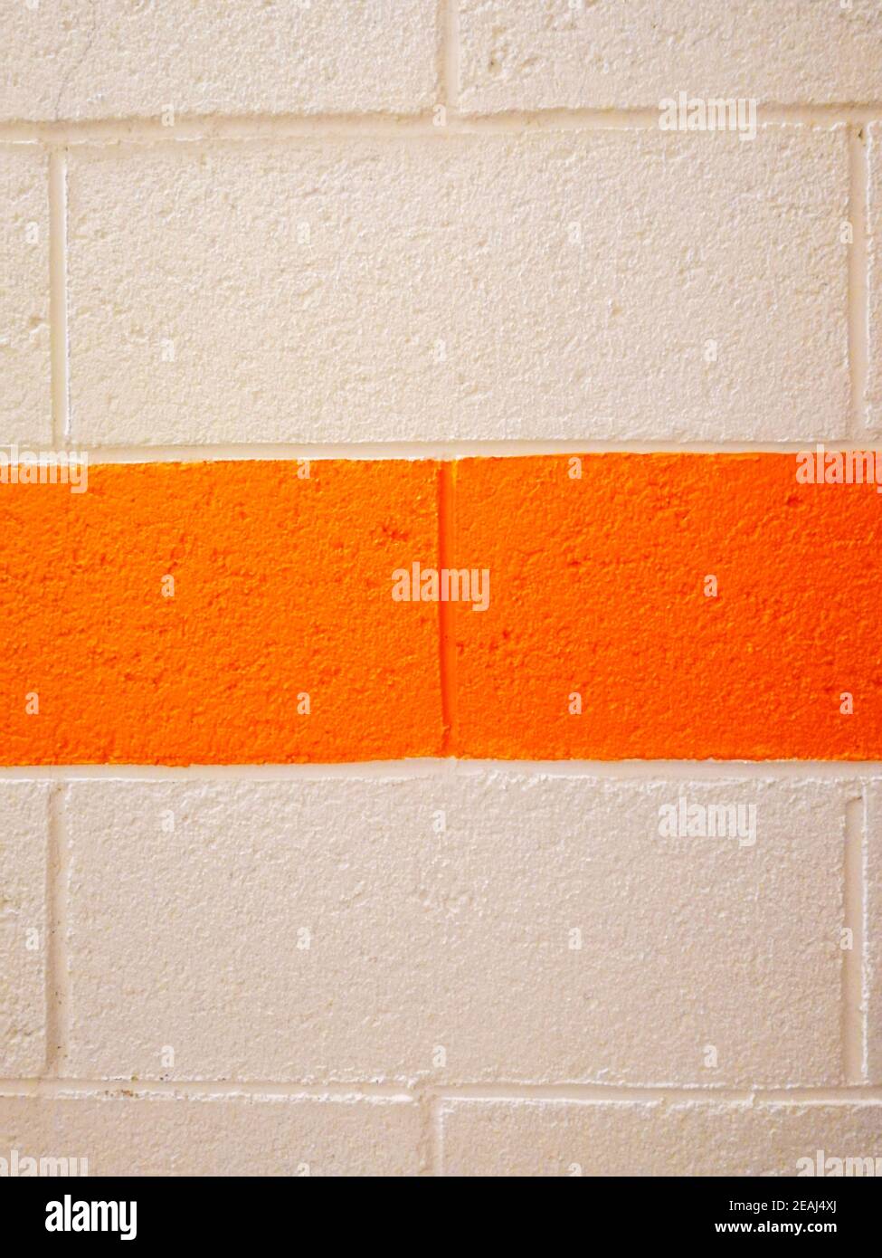 white wall orange stripe brick Stock Photo Alamy