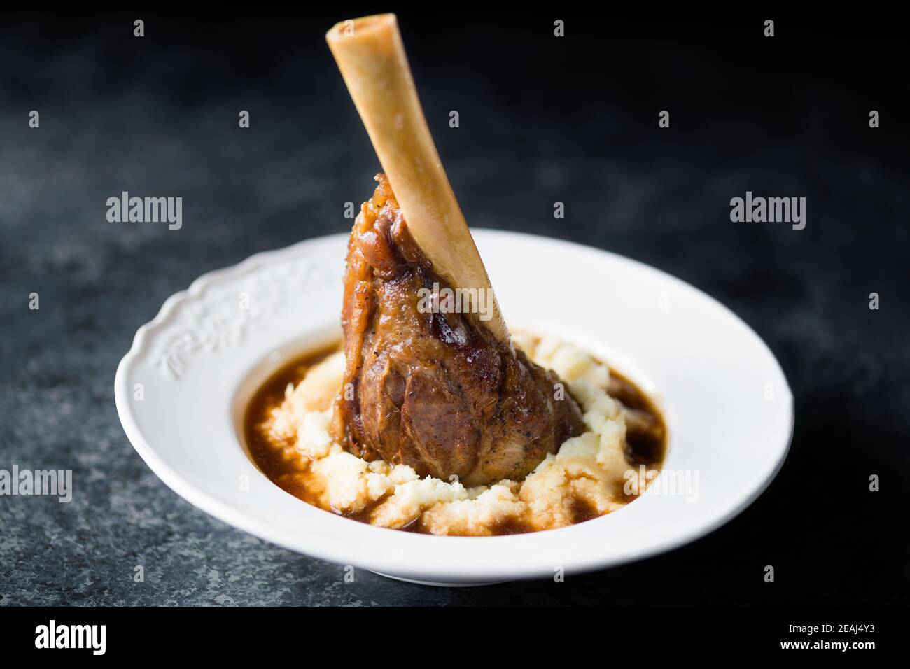 rustic english lamb shanks with mashed potato comfort food Stock Photo