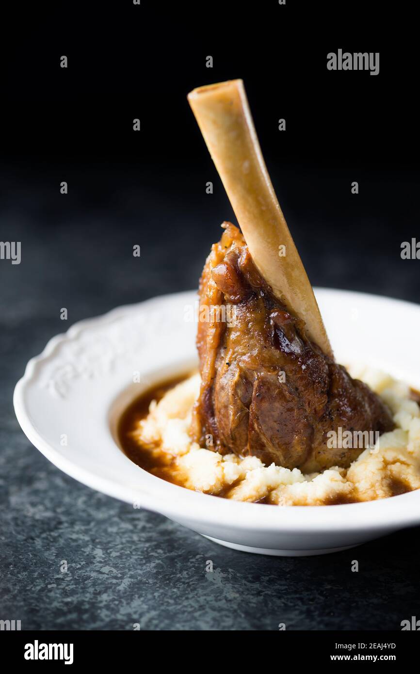 rustic english lamb shanks with mashed potato comfort food Stock Photo